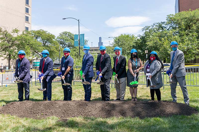 Groundbreaking for the new Outpatient Surgery Center & Specialty Clinics at UI Health on Aug. 13. From left, Chicago Ald. Walter Burnett, Jr., 27th Ward; UIC Vice Chancellor for Health Affairs Dr. Robert Barish; Illinois Sen. Omar Aquino, 2nd&nbsp;District; Illinois Senate President Don Harmon; UIC Chancellor Michael Amiridis; University of Illinois System President Timothy Killeen; Illinois Rep. Theresa Mah, 2nd&nbsp;District; Illinois Rep.-elect Lakesia Collins, 9th&nbsp;District; and University of Illinois Hospital & Clinics CEO Michael Zenn. (Photo: Joshua Clark/University of Illinois Chicago)
