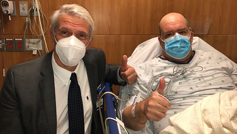 . Pier Giulianotti, director of the Robotic Surgery Program at UI Health, with patient Christopher Adamsick on Sept. 24, 2020. Adamsick is the world&rsquo;s first polycystic kidney disease patient to receive a robotic double nephrectomy and kidney transplant.