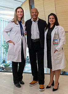 Donald Barge with surgical oncologist Dr. Elise Bianchi (left) and medical oncologist Dr. Shikha Jain (right).]