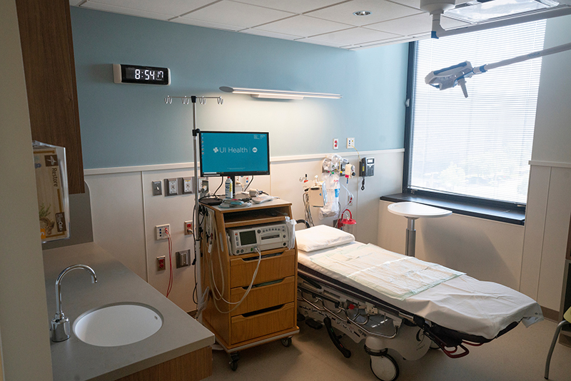 Room with a hospital bed and computers